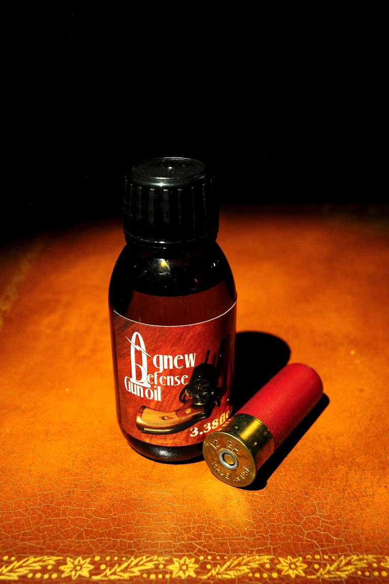 Agnew Defense Gun Oil with 12 Gauge Cartridge